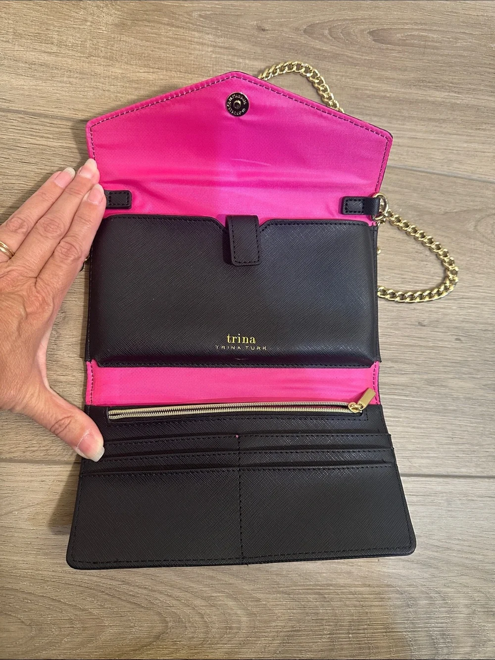 Trina Turk pink, red, black and blue cross body clutch with gold tone chain